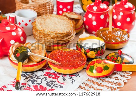 Traditional russian pancake with caviar and tea Royalty-Free Stock Photo #117682918