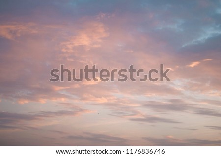 Beautiful picture with a bright sunset. All the colors on the clouds shine from the evening sun. Beautiful natural background.
