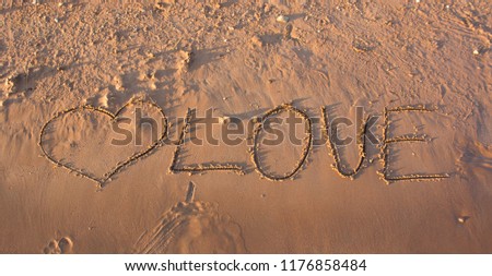 inscription on wet sand