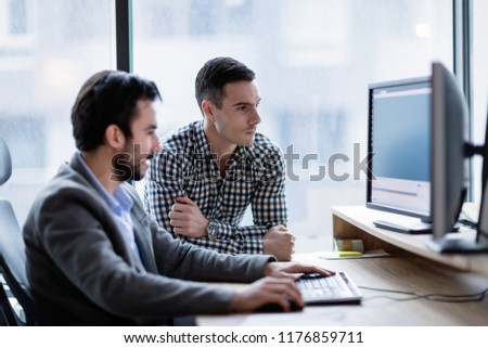 Picture of businesspeople working on computer together