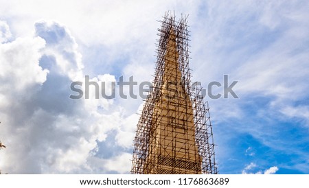 Construction and repair of high pagodas and sky clouds background