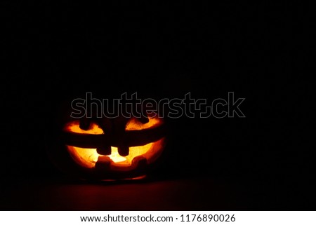 Halloween pumpkin head jack lantern in the night