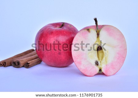 apples and cinnamon on a white background,