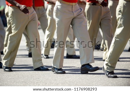 Military marching in a street. Legs and shoes in line.