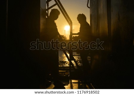 silhouette of a woman and sunset background 