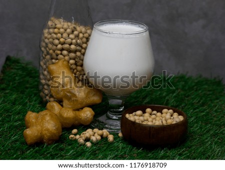 soybean milk and Soybean  isolate on green grass background
