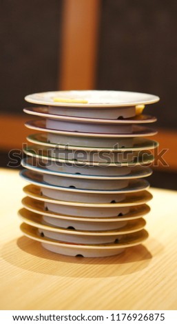 Tower of empty sushi dish