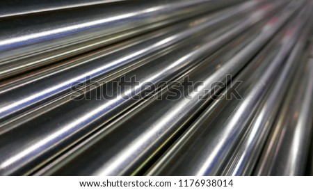 Metal bars, chrome plated, shiny, diagonally arranged in a radial direction,