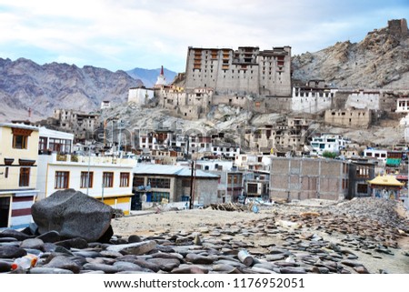 Old town in a deserted valley. Far away the prosperity of Leh India