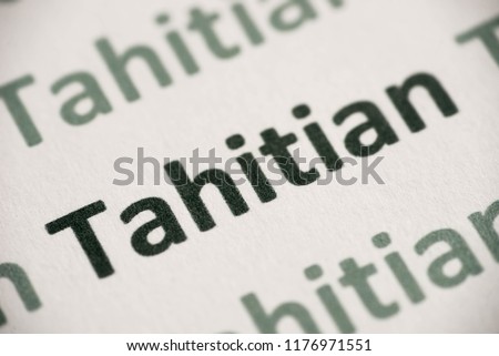 word Tahitian language printed on white paper macro