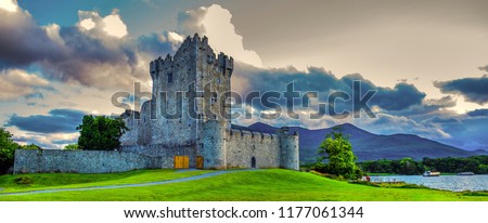 Idyllic landscape of Ross Castle in the Killarney National Park in Ireland. Travel by car through the Ring of Kerry. Royalty-Free Stock Photo #1177061344
