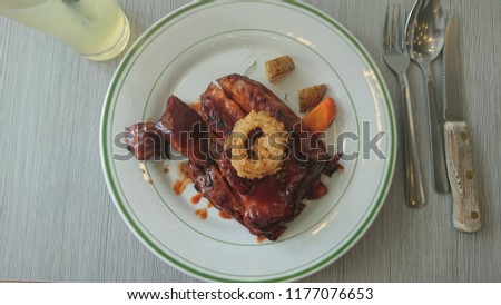 Baby Back Ribs dish with utensils flat lay shot