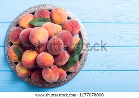 Ripe peaches fruit on rustic background . Summer healthy food