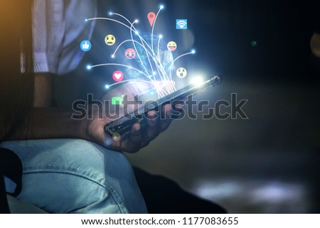 Woman hand holding smart phone with graphic icon multichannel online banking payment network communication,description Element of this image furnished by Nasa