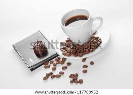 Picture of a cup of coffee, seeds, candy and cards