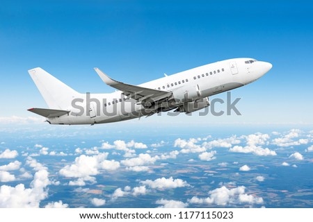 Airplane in the sky above the clouds flight journey sun height. Royalty-Free Stock Photo #1177115023