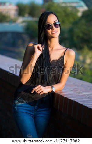 Portrait of a beautiful fashionable young brunette.
