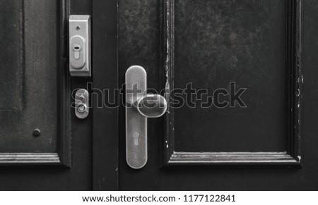 Lock door in house and silver knob and wall background.