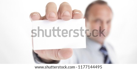 blurred image. businessman showing a blank business card