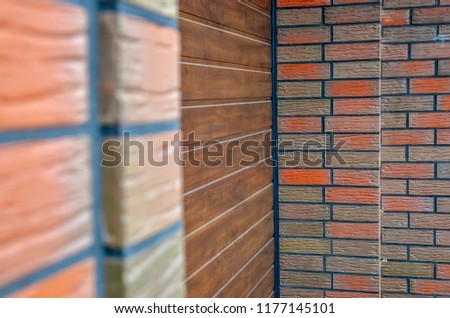 Side view of a dark brown garage door. Selective focus. 