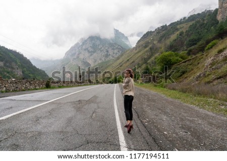Girl on a background of mountains