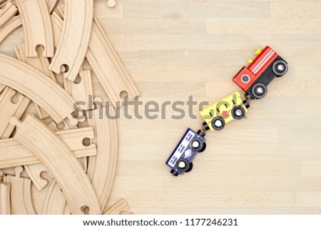 A studio photo of a wooden train track