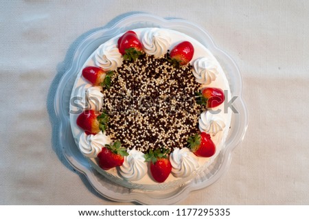 chocolate pie with white and black chocolate with whipped cream and strawberries