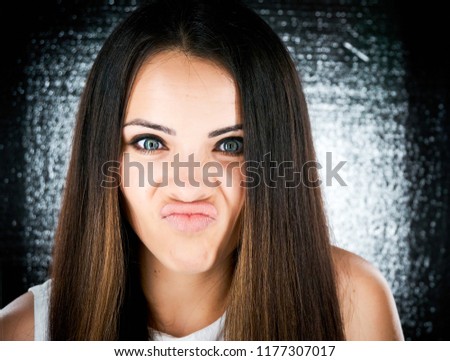 silly young woman making funny faces
