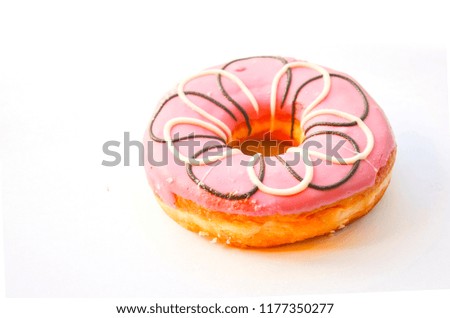 Colorful Sweet donut in a glaze with sprinkles isolated on white background.