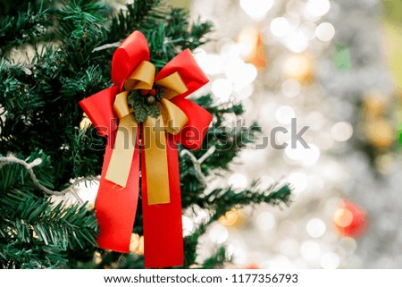 Red and Golden bow on Christmas Tree