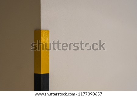 Yellow and black marking on the wall with copy space