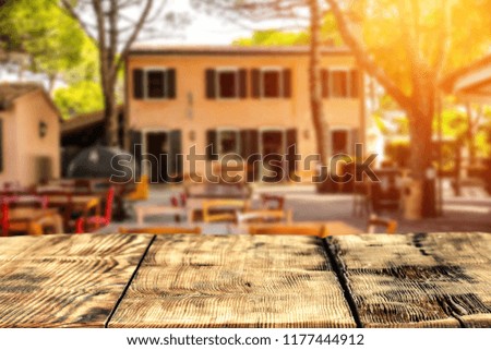 wooden table in an old Italian restaurant at sunrise