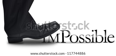 A business man's foot is stepping on the work impossible to make the work possible. There is a white background. use it for a motivational concept. Royalty-Free Stock Photo #117744886