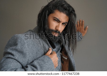 Hipster guy with grey coat, isolated