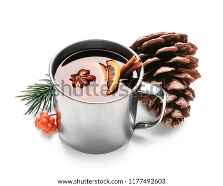 Metal cup of delicious mulled wine on white background