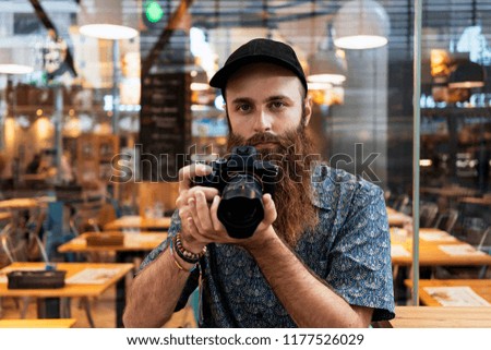 Professional Photographer taking photos in the street