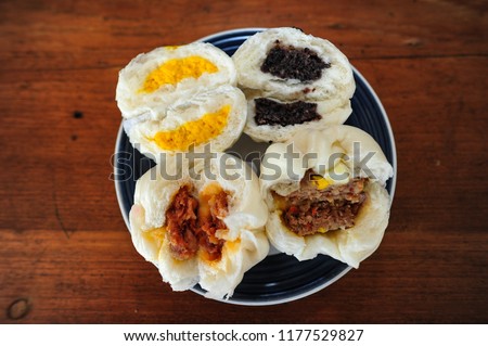 Steamed buns on a plate. Royalty-Free Stock Photo #1177529827