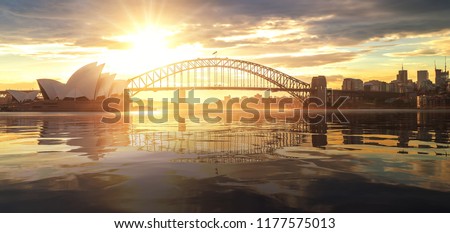 Cityscape of Sysney harbour and bridge with morning sunrise moment and boat in the sea, New south wales, Australia, this immage can use for travel, trorist and Sysney concept 