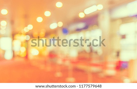 Abstract Blurred image of airport 's hallway with bokeh  for background usage. (vintage tone)
