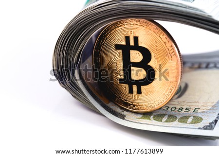 one golden bitcoin and dollars