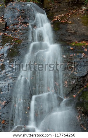 Tom Branch Falls, in the Great Smoky Mountains National Park, near Bryson City, North Carolina, in the fall of the year with the leaves turning different colors