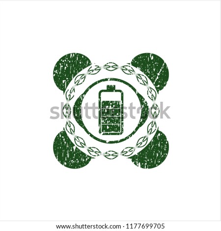 Green battery icon inside distress rubber grunge texture seal
