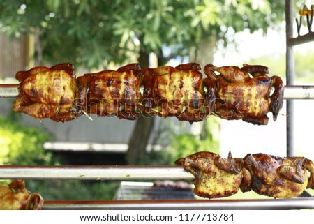 Grilled chicken, Thai food, background blurred, focus only on the spot in the picture