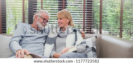 Portrait happy old couple smiling in living room home, caucasian senior couple relax sofa. Healthcare hygge lifestyle elderly retirement together love valentines day, quarantine at home concept banner