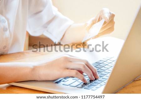 Lady hold credit card in hand during online shopping 