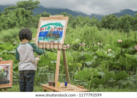 Children drawing natural coloring in the foreground, The joy of children.
