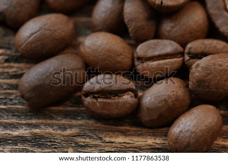 Coffee beans on wooden background. Coffee mood. Macro photography