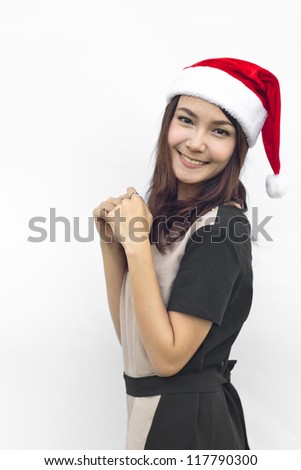 Christmas woman smiling in red Santa hat. Isolated on white background.