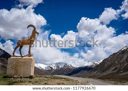 Pamir Highway or M41 Highway, the World’s Second Highest Altitude International Road with symbol mark of Pamir Siberian Ibex or Marco Polo sheep on road side, Tajikistan.