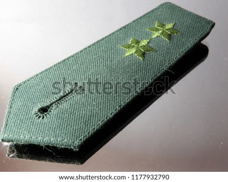 epaulettes or shoulder strap with two green stars